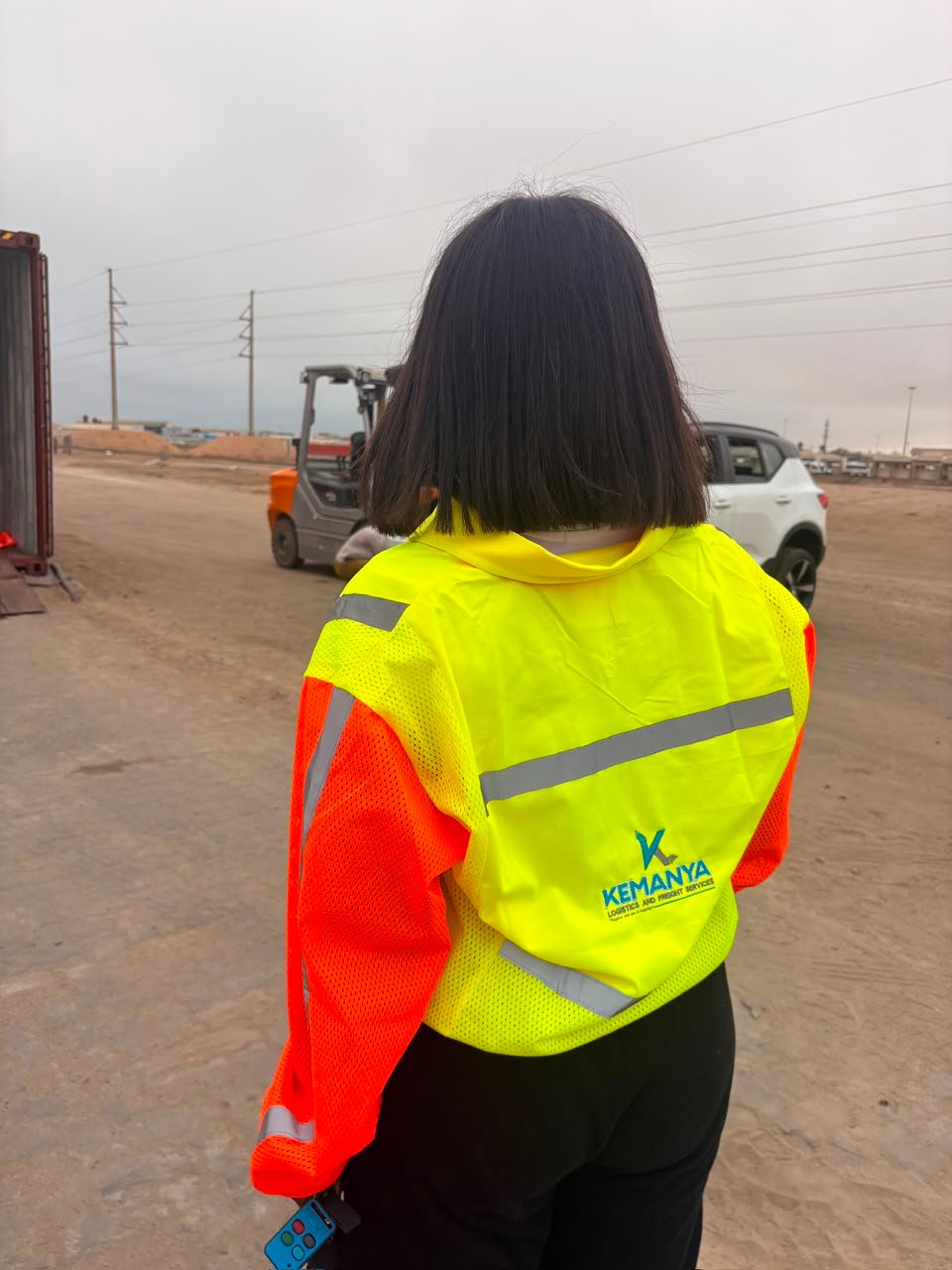 Kemanya team in branded high-visibility gear at the port