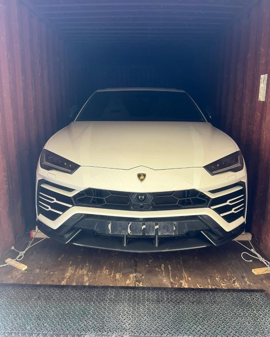 Luxury vehicle loaded inside a shipping container for export